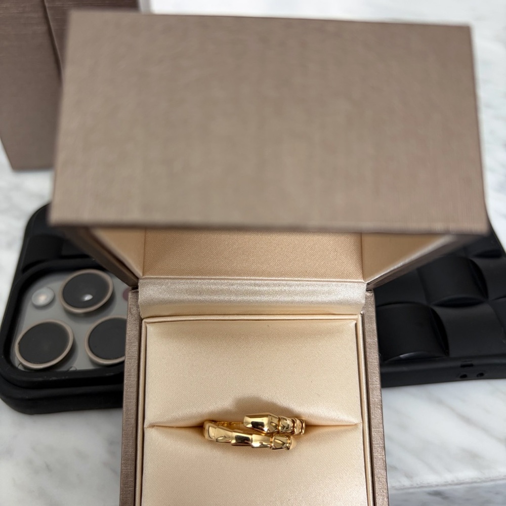 Bulgari 18K Gold Ring 
Ring Size L ( 6 1/2 to 7 1/4 inches).  Sold Out